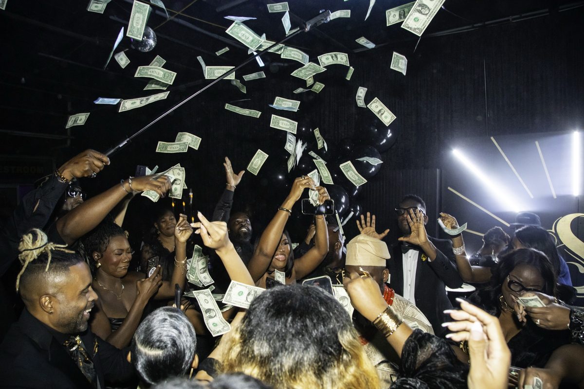Guests spraying money on the dance floor, photo 4